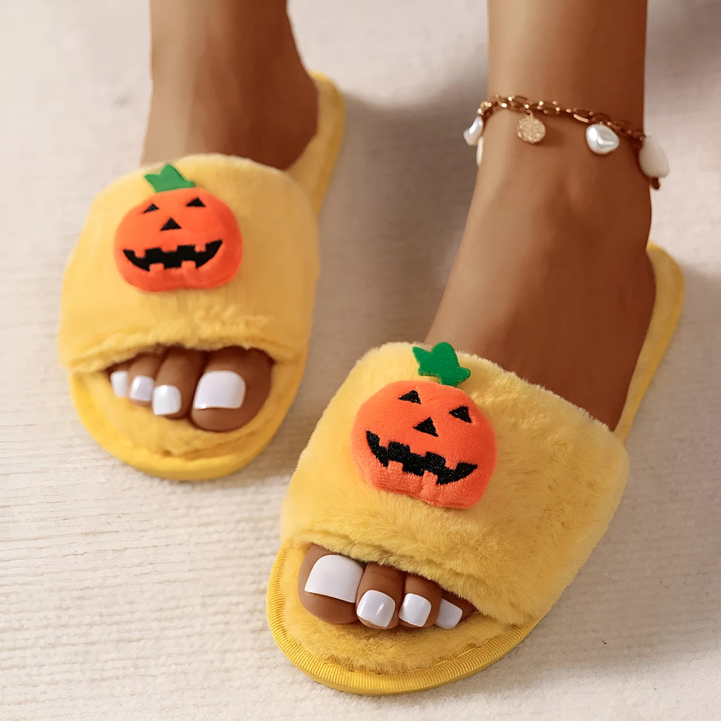 Halloween pumpkin plush slippers with synthetic fur uppers and PVC soles in white and yellow