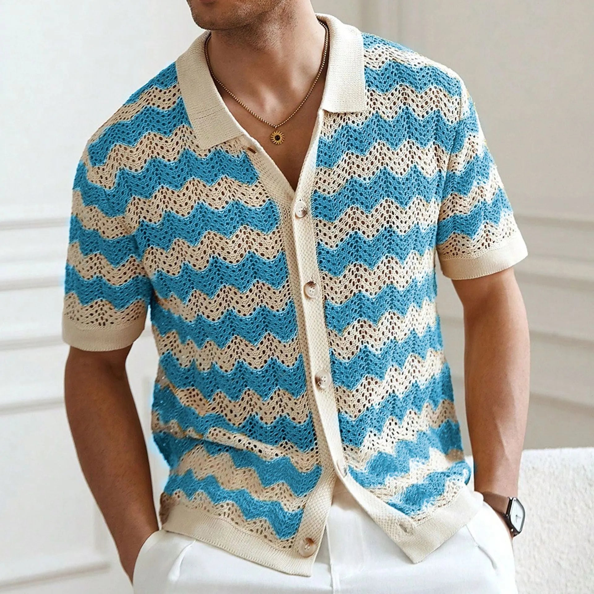 Yellow hollow jacquard corrugated short sleeve sweater with flocking detail on a hanger.