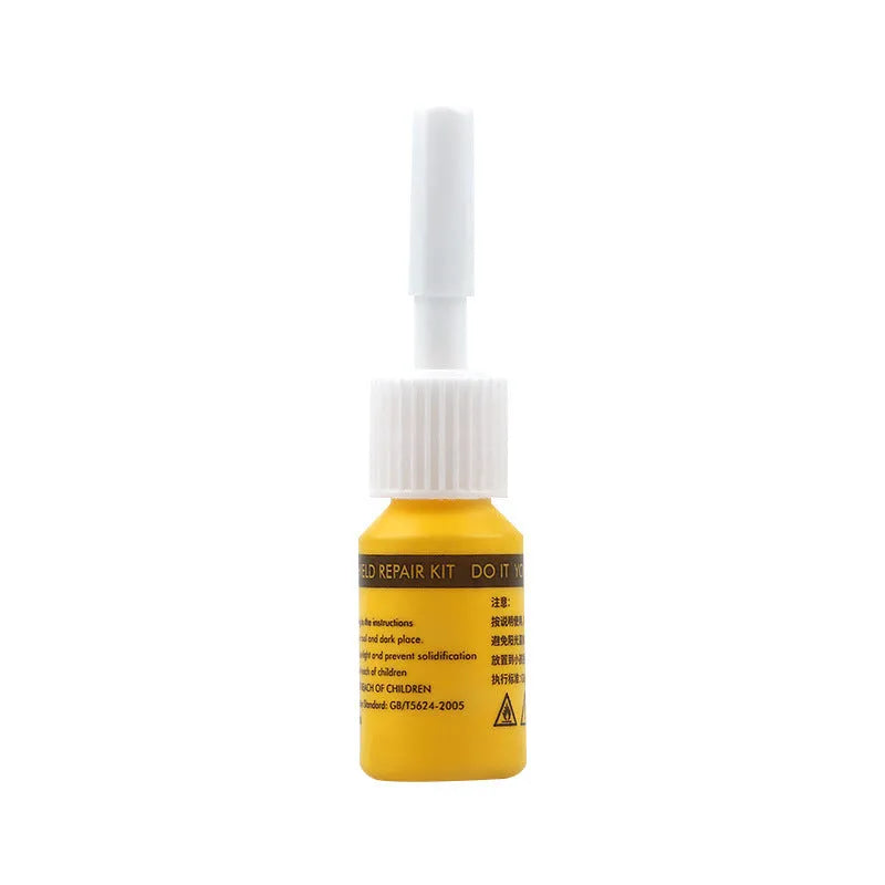 Yellow three-piece car windshield repair kit with glass repair liquid and application tools
