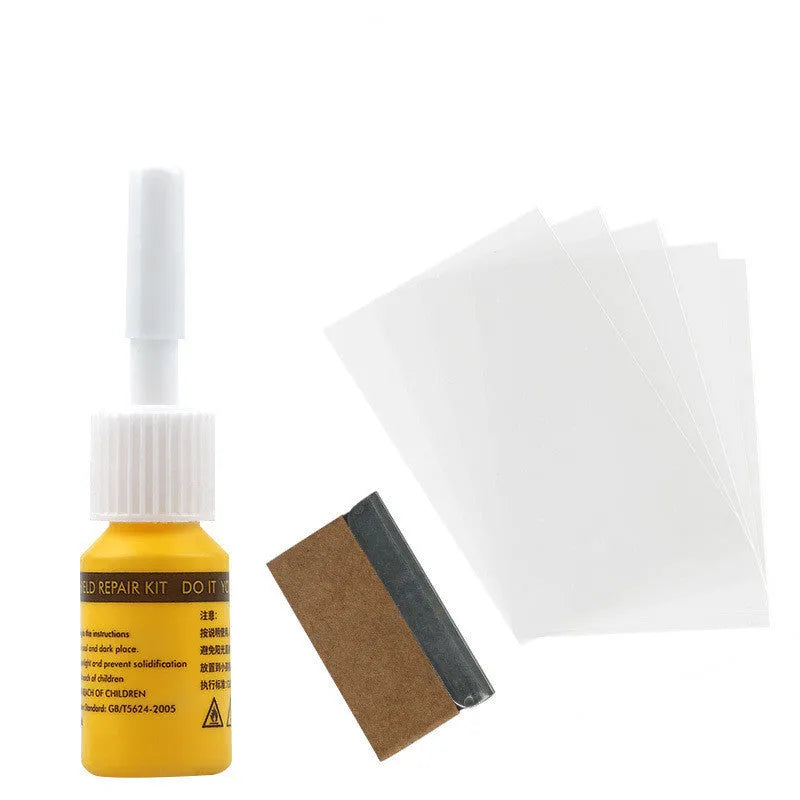 Yellow three-piece car windshield repair kit with glass repair liquid and application tools