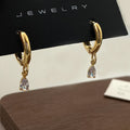 Women's zircon jewellery set with geometric pendant necklace, matching earrings, and anklet
