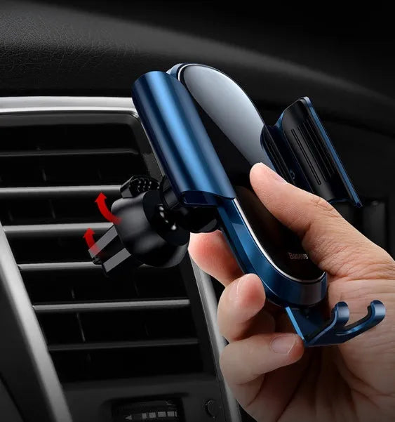 Universal smart car bracket with adjustable silicone arms, mounted on a car air vent holding a mobile phone.