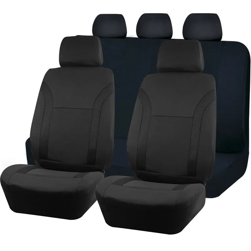 Blue polyester car seat cover with eyelet stitching on a car seat, showing front and headrest pieces.