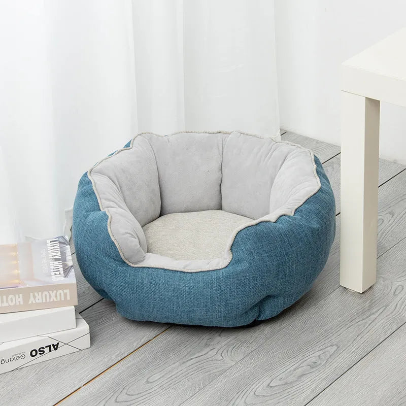 Blue octagonal pet bed for small dog with high sides and removable interior mat.
