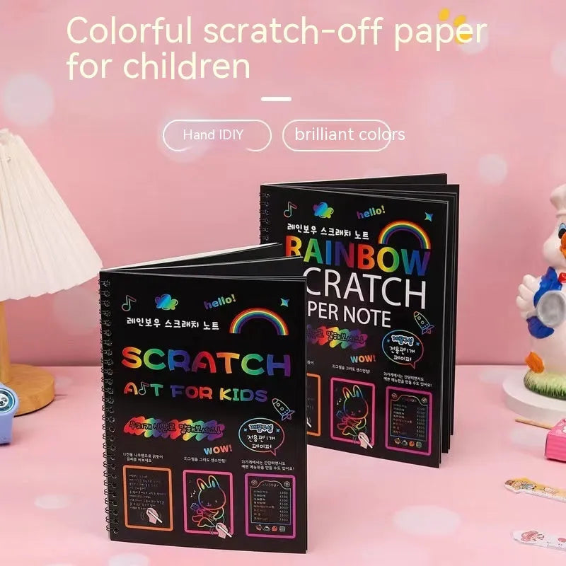 Large colourful children's scratch art paper measuring 26 by 19 centimetres with scraping tool.