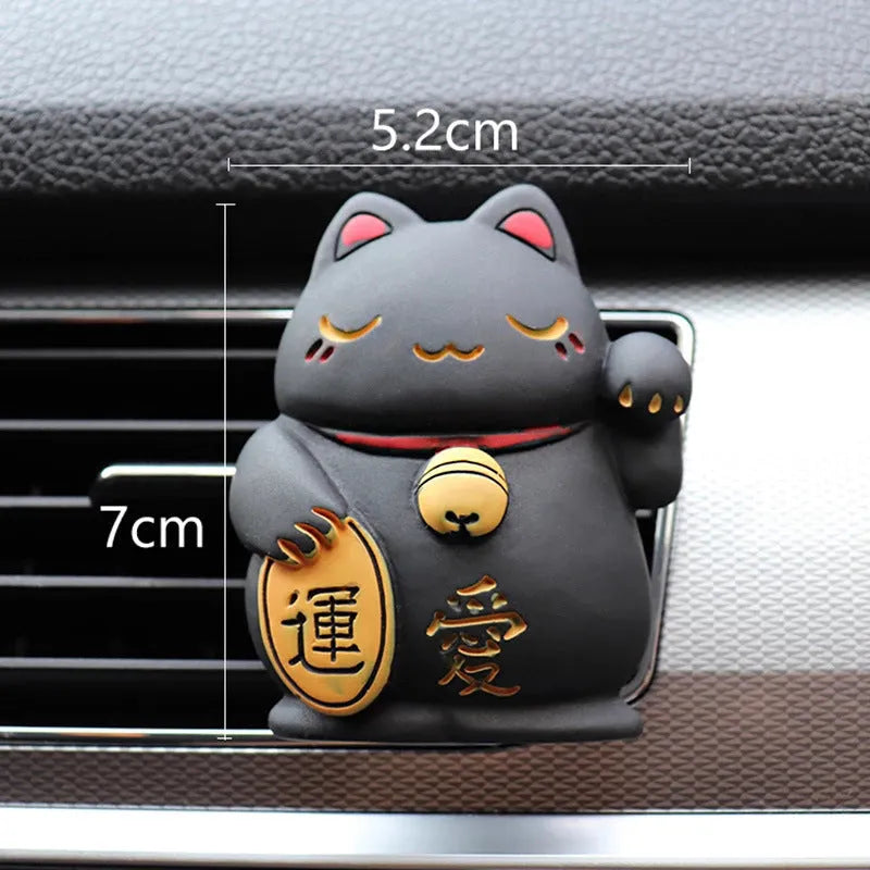 Black and white resin fortune cat car vent aromatherapy clip with aromatherapy cotton.