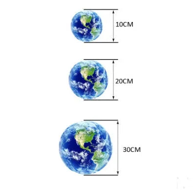 Glow in the dark blue and green Earth planet wall sticker on a bedroom wall.