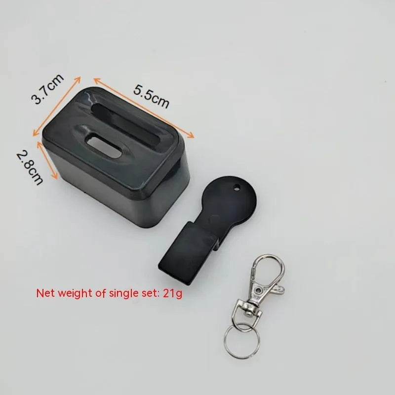 Black plastic seat belt lock protective device clipped onto vehicle seat belt buckle