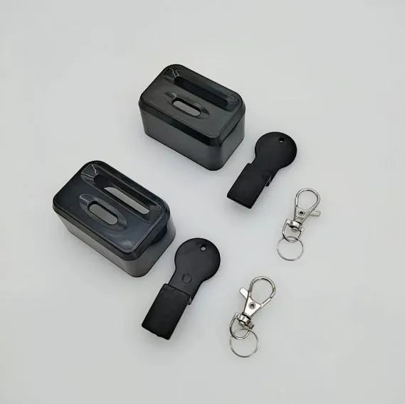Black plastic seat belt lock protective device clipped onto vehicle seat belt buckle