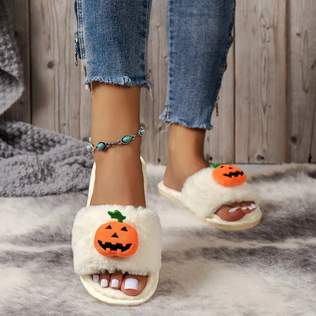 Halloween pumpkin plush slippers with synthetic fur uppers and PVC soles in white and yellow