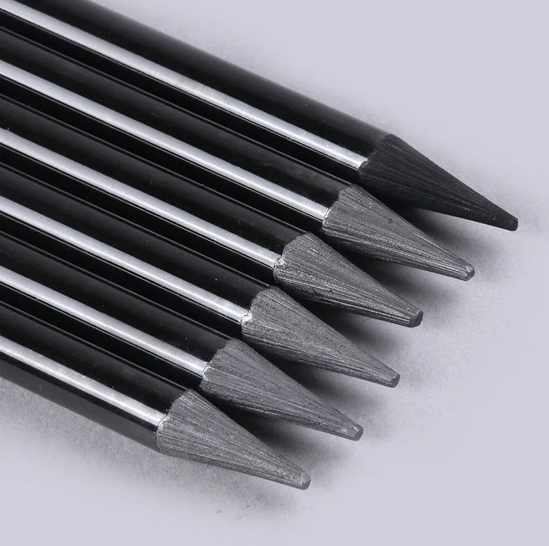 Graphite and carbonized wooden drawing pencils with solid lead cores on suction card packaging