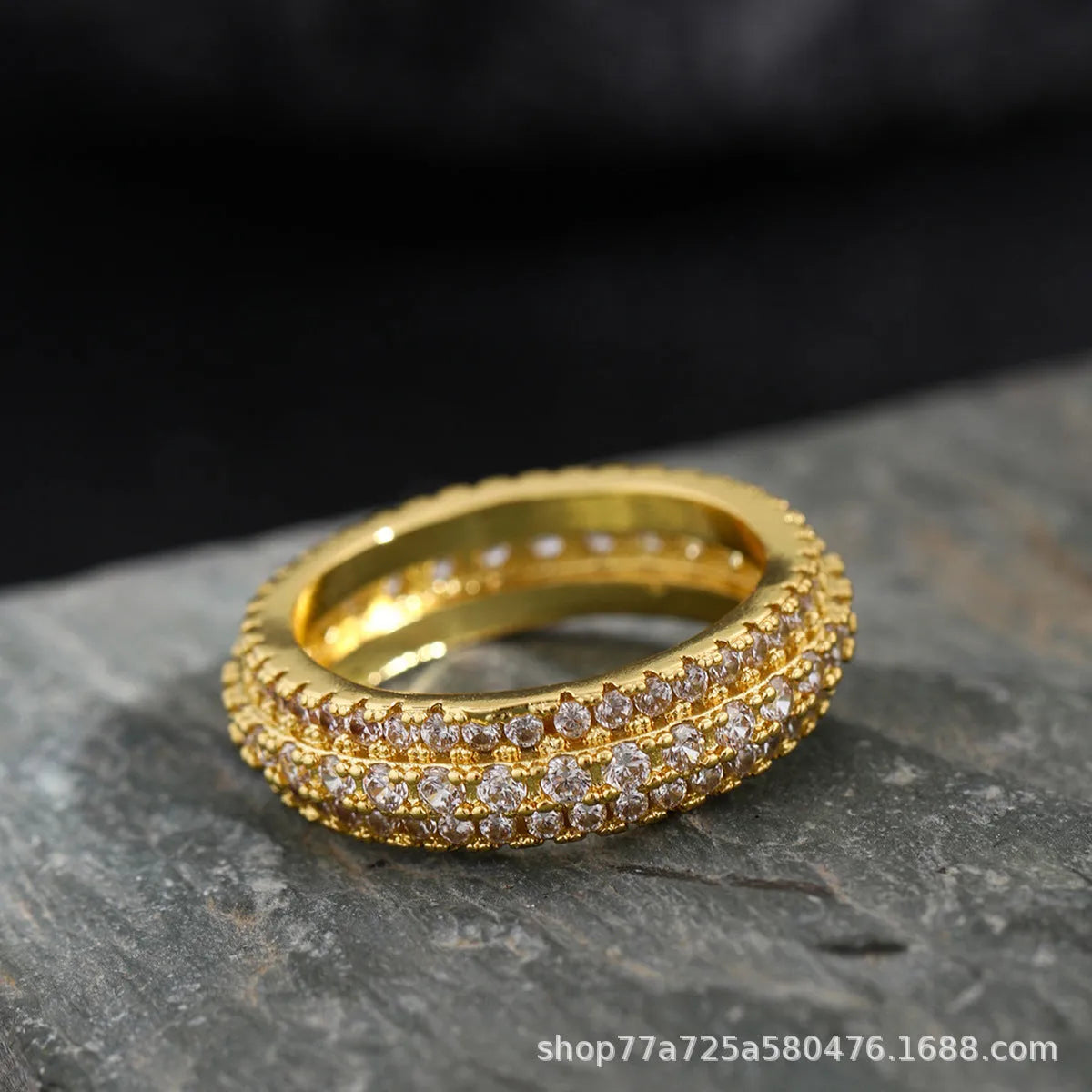 Geometric copper ring with a triangular zircon stone inlay, shown in a choice of colour finishes.