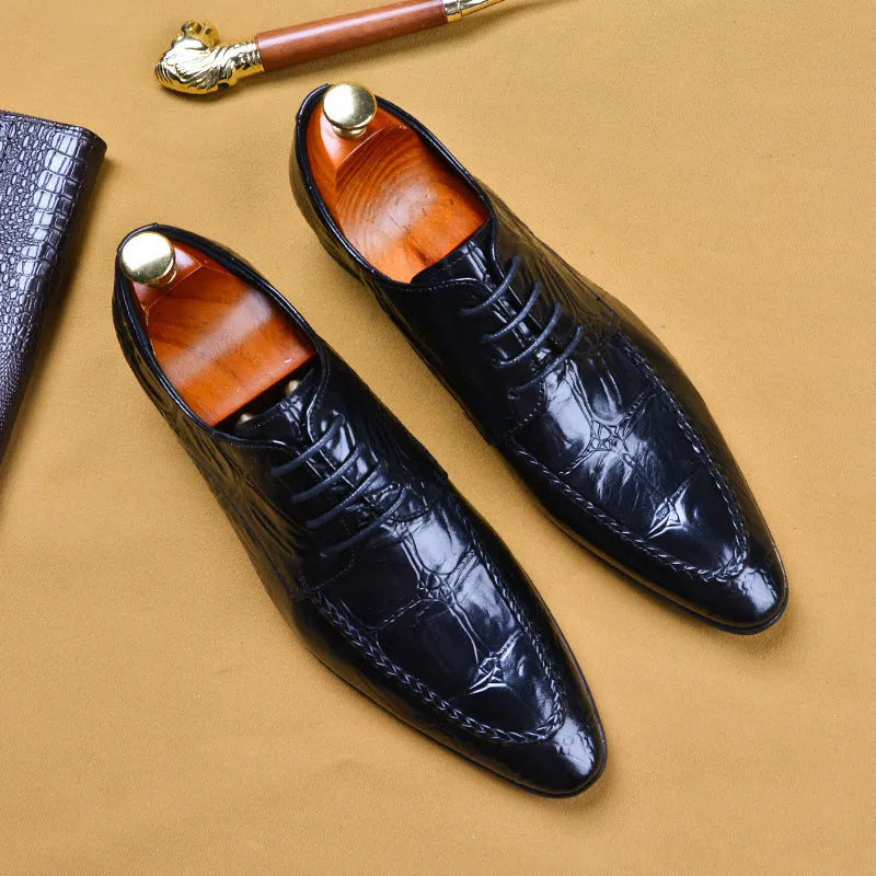 Men's black alligator pattern leather shoes with a silver horse bit buckle on the front.