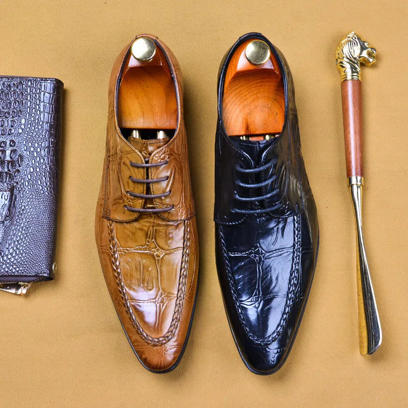 Men's black alligator pattern leather shoes with a silver horse bit buckle on the front.