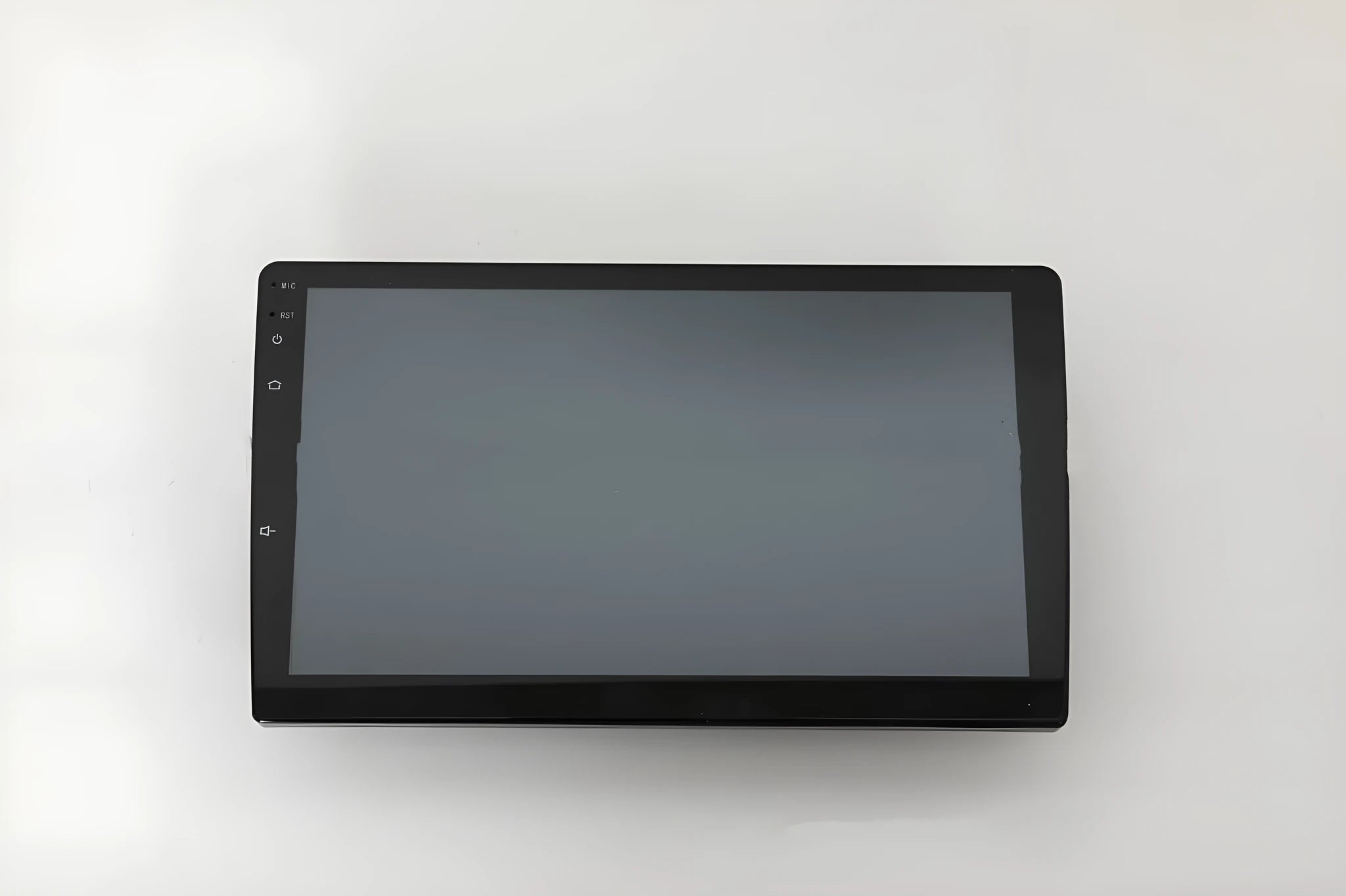 10.1 inch Android universal car stereo with black trapezoidal touch screen panel