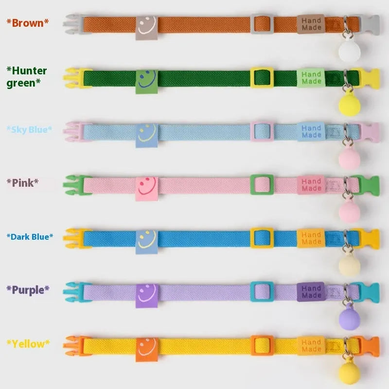 A small dog's polyester elastic pet collar in a solid colour with a monochrome pattern.