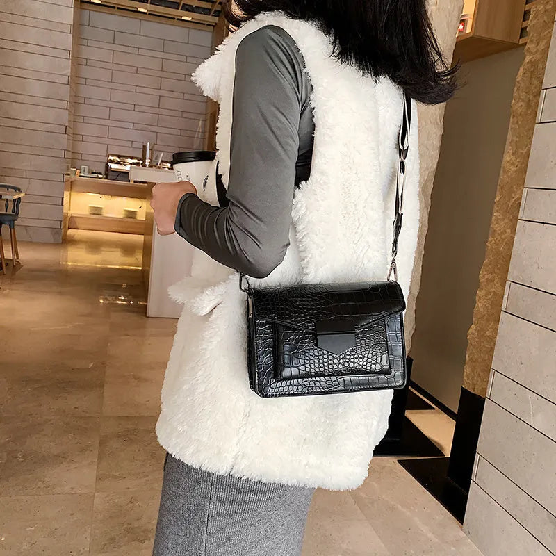 Vintage-style crossbody bag in PU leather shown in black, dark brown, khaki, or red