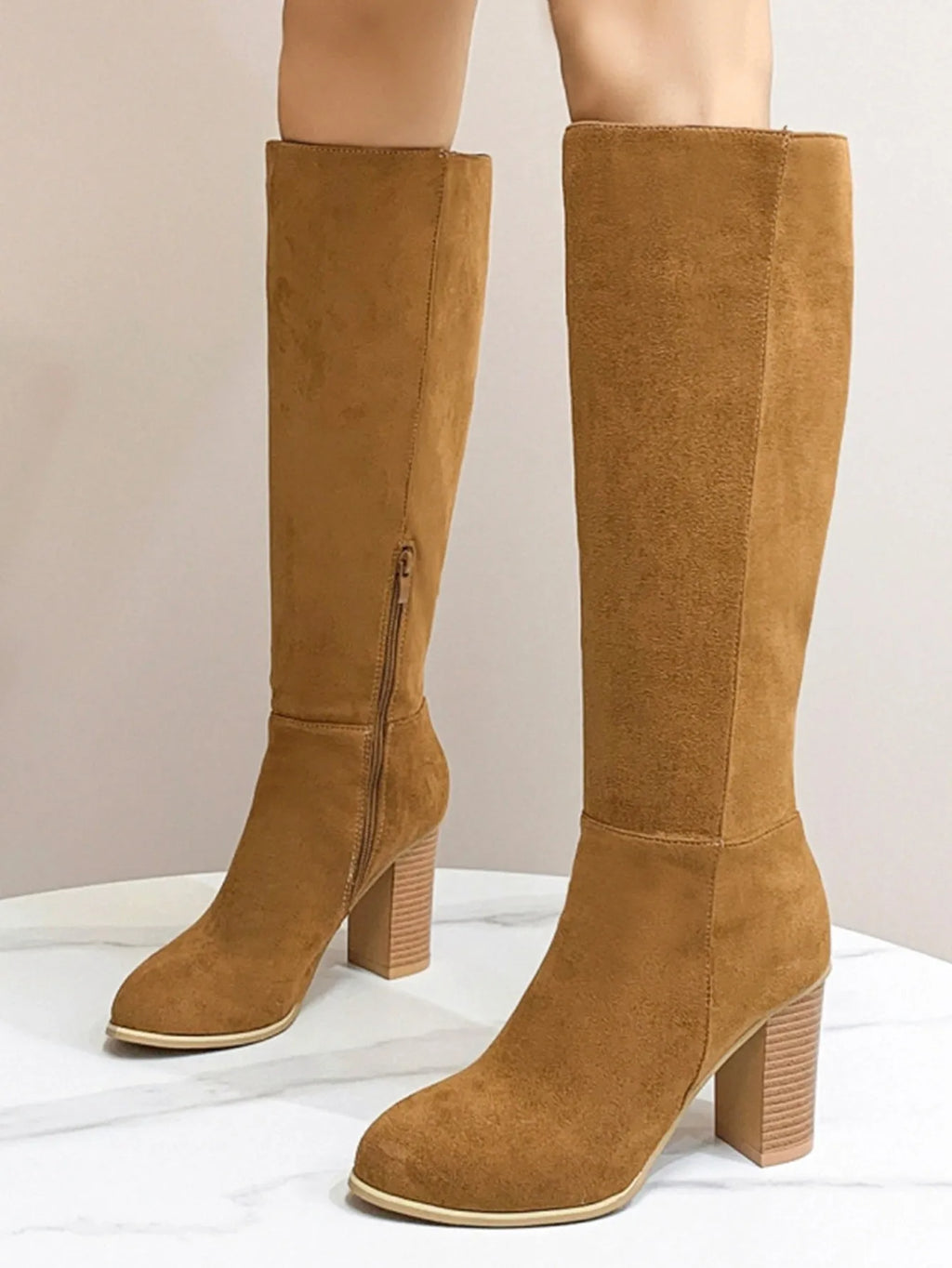 Women's black square toe high heel fashion boots made from artificial PU material.