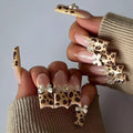 Leopard print and butterfly design false nails in WM296 colour, plastic construction