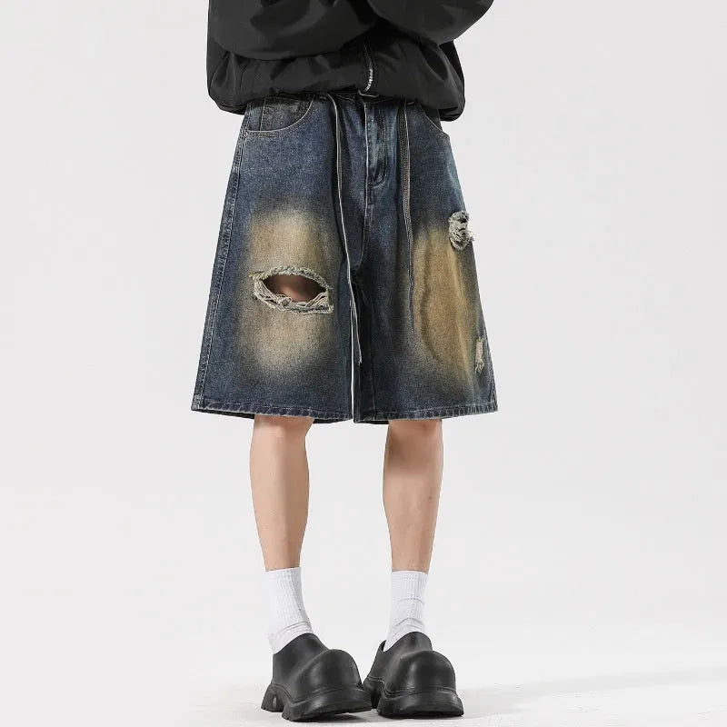 Retro blue loose fit ripped jeans with distressed detailing and cotton denim construction