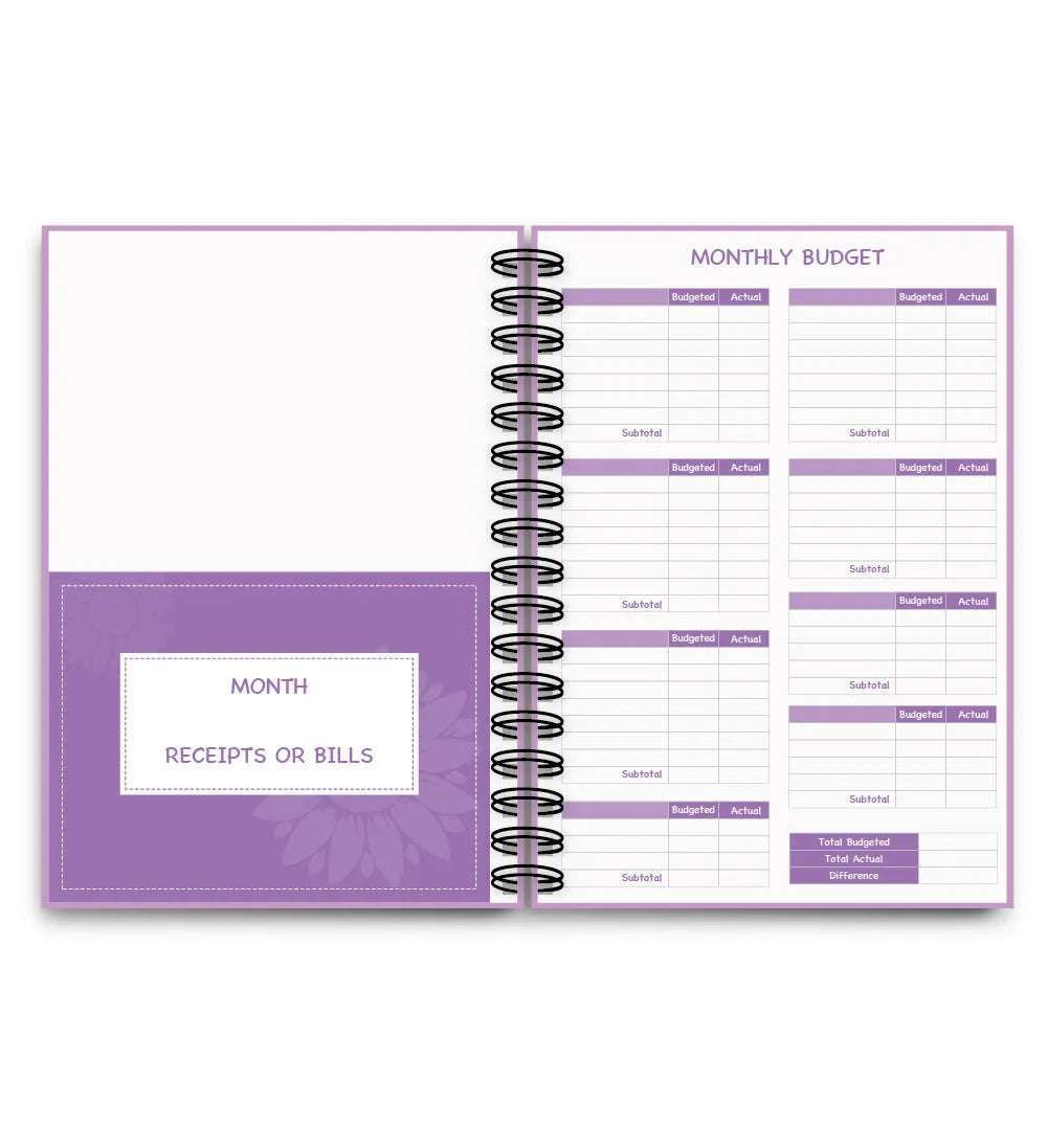 Purple coil-bound A5 financial planning notebook with pen, stickers, and paper clips for monthly budgeting
