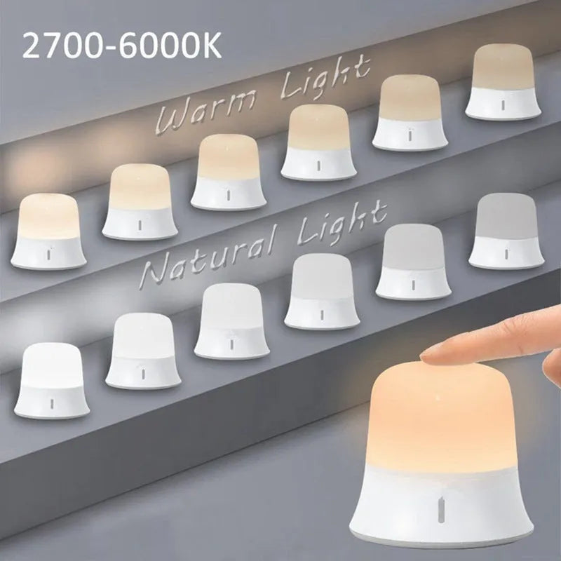 White touch-control baby night light with motion sensor on a nursery bedside table.