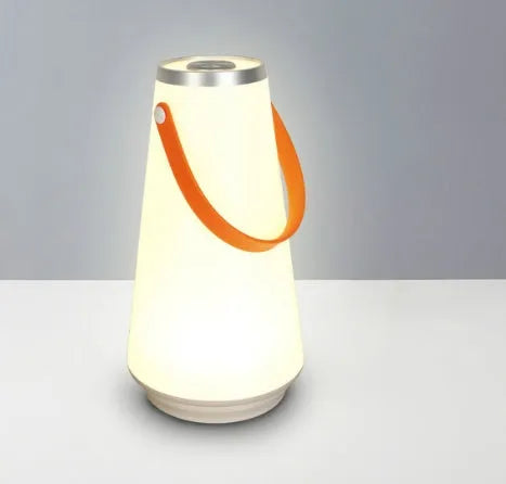 White rechargeable LED table lamp with adjustable warm light settings and USB charging cable