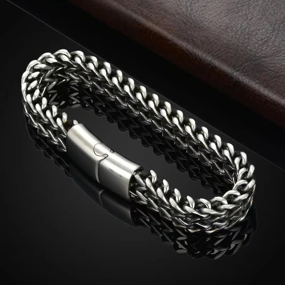 Geometric stainless steel bracelet with front and back detailing in silver colour