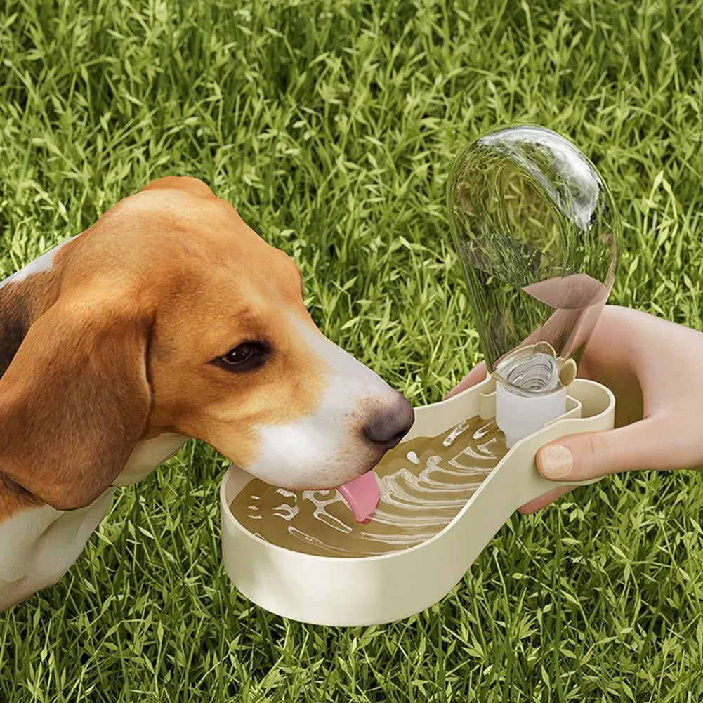 Orange and white portable pet water feeder with water bottle and food container for dogs and cats