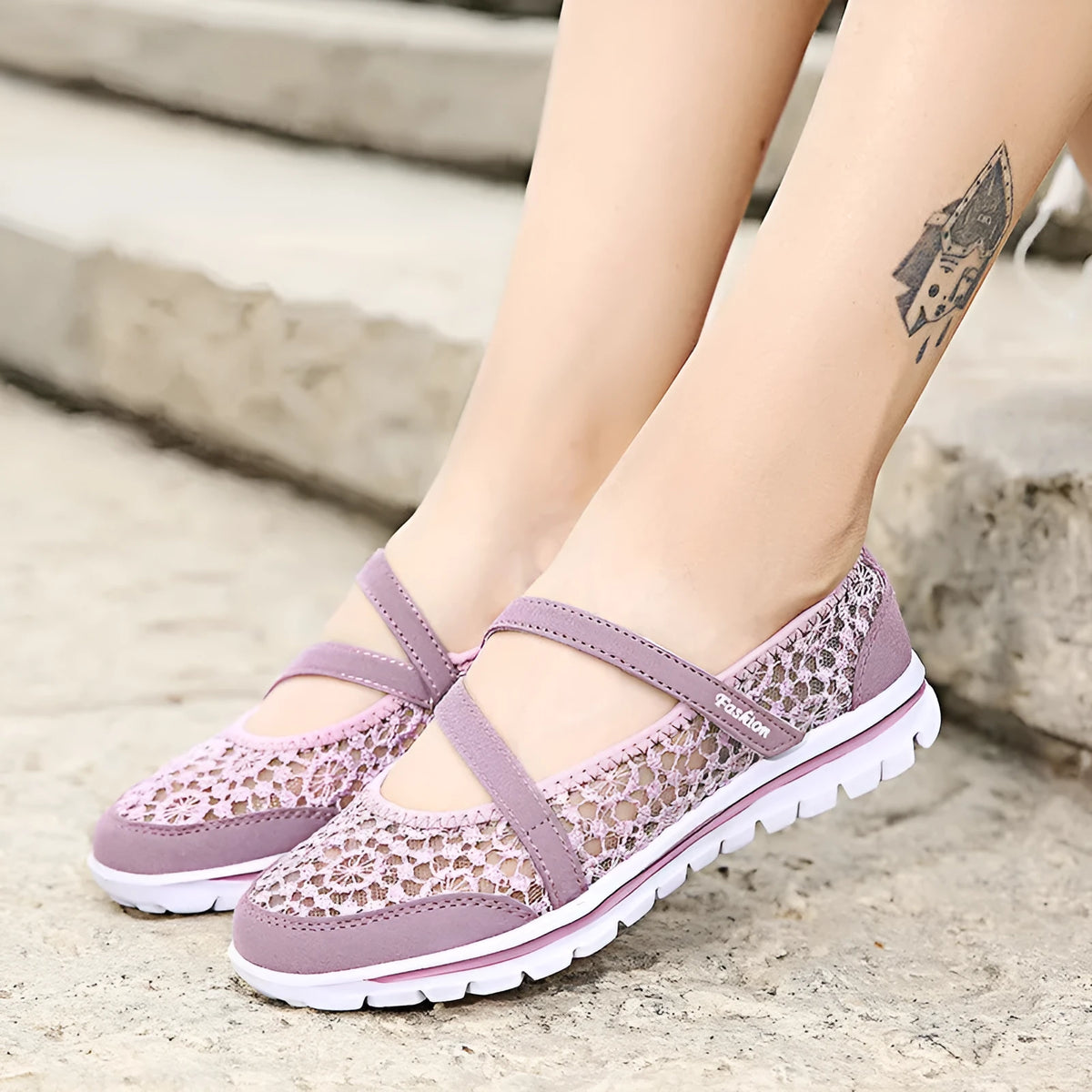 Women's beige lace-up flat casual shoes with mesh upper and sewing line detail on a white background.