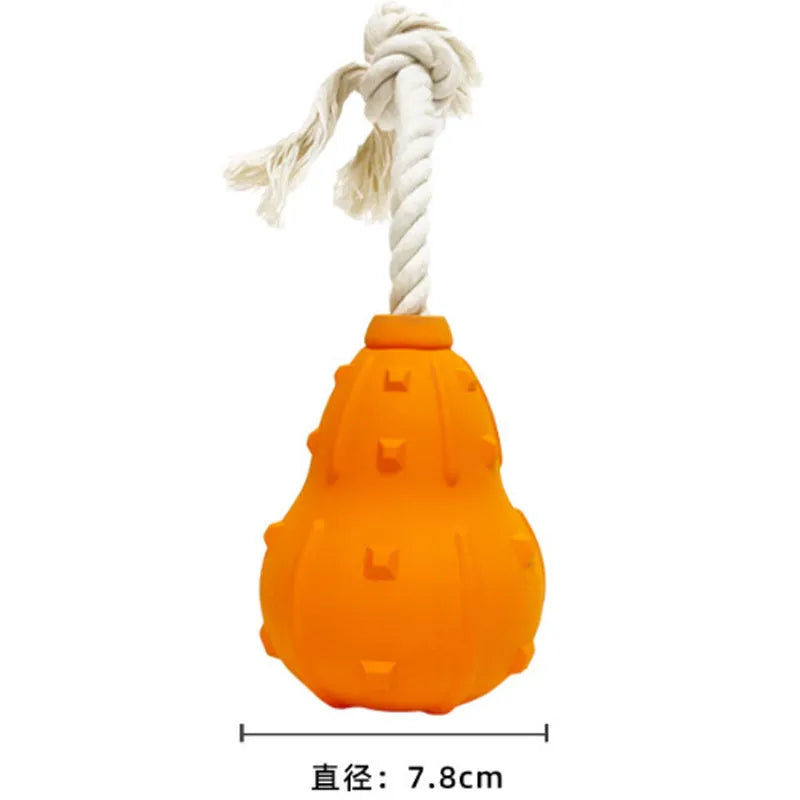 Natural rubber stuffable dog toy with treat hole and strap for small medium breed dogs.