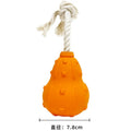 Natural rubber stuffable dog toy with treat hole and strap for small medium breed dogs.