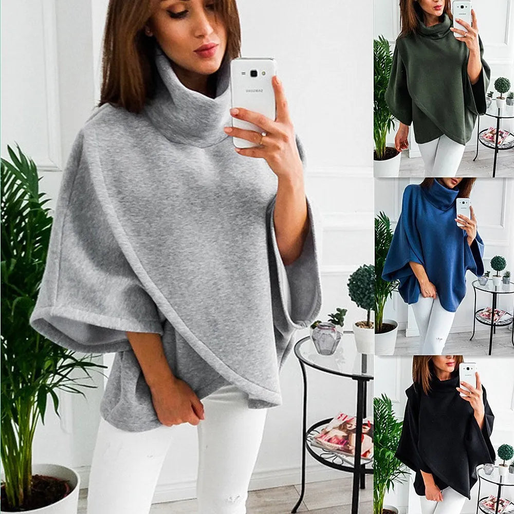Long black women's cardigan sweatshirt with batwing sleeves and decorative stitching, shown open over a top.