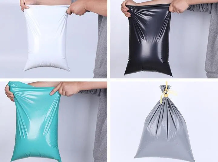 Bundle of 100 clear PE plastic courier bags with adhesive seals in various sizes on a white background.