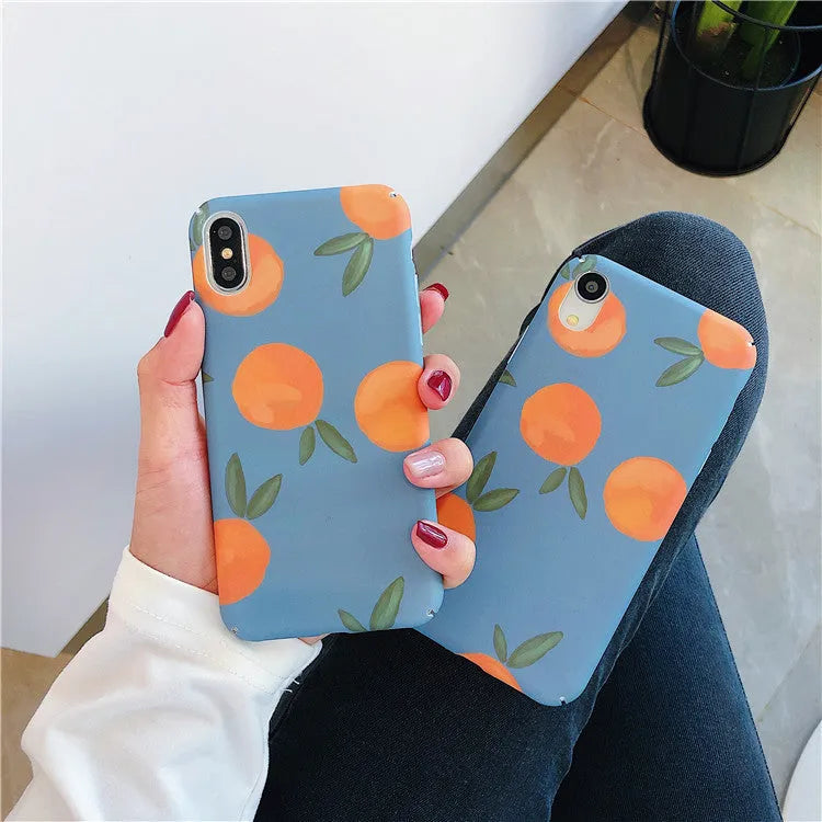 Orange retro plastic back cover phone case for iPhone on a blue and water background.