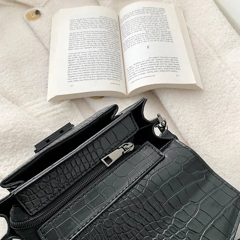 Vintage-style crossbody bag in PU leather shown in black, dark brown, khaki, or red