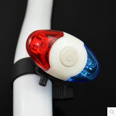 Red and blue LED tail light with adjustable mounting base shown in use.