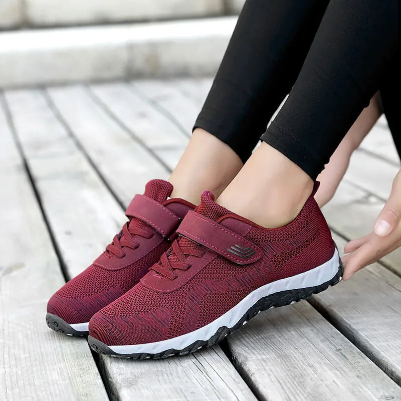 Women's low-top wedge heel shoe in mesh with Velcro strap, shown in a solid colour.