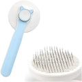 Blue self-cleaning cat grooming brush with rubber handle and round-tip needles.