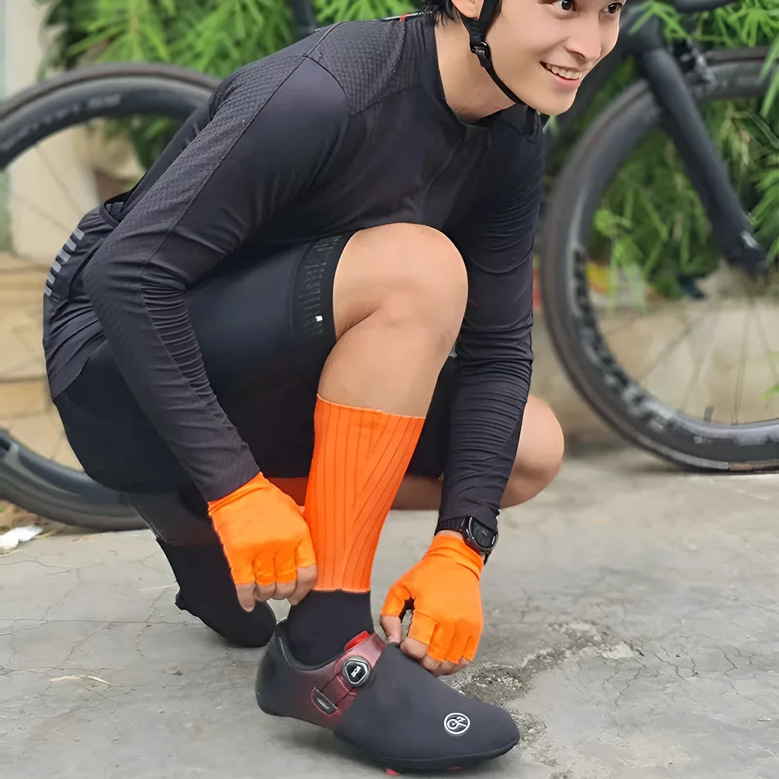 Athletic sports socks for cycling and running in six colour options including orange, black, and purple.