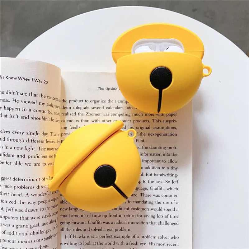 Yellow silicone bell-shaped case for AirPods with metal keychain ring attached