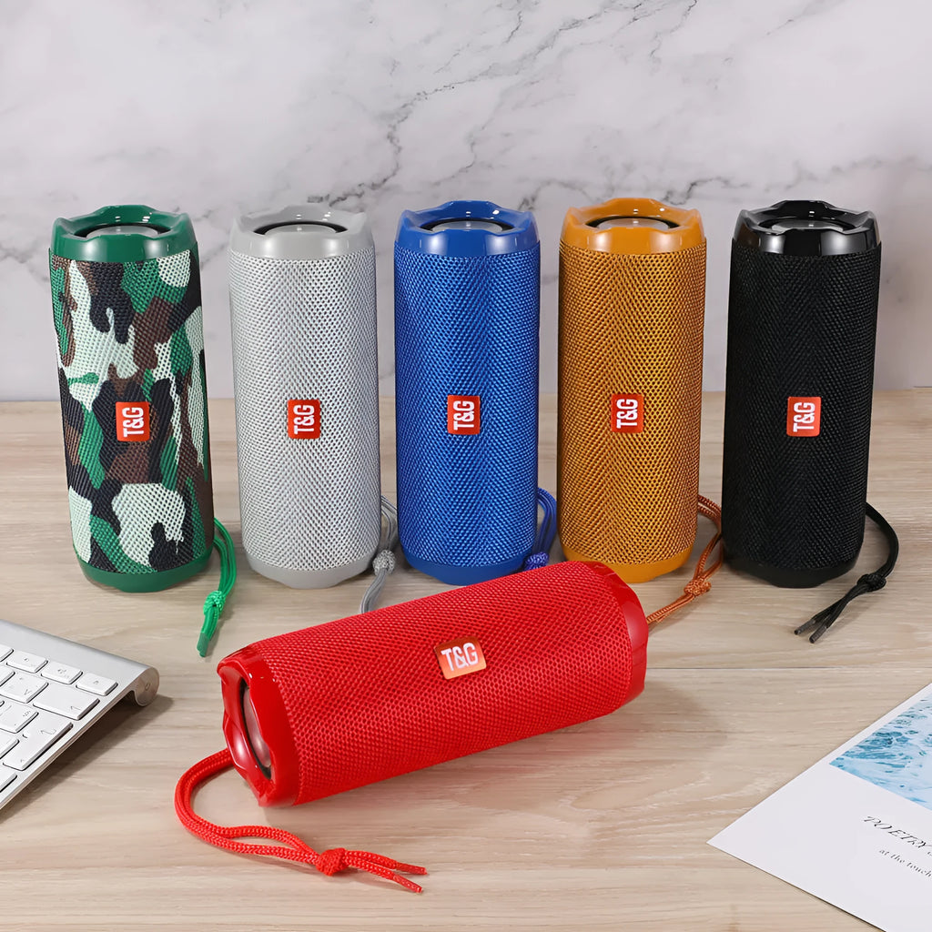 Fabric portable Bluetooth speaker with integrated card holder shown in multiple colour options.