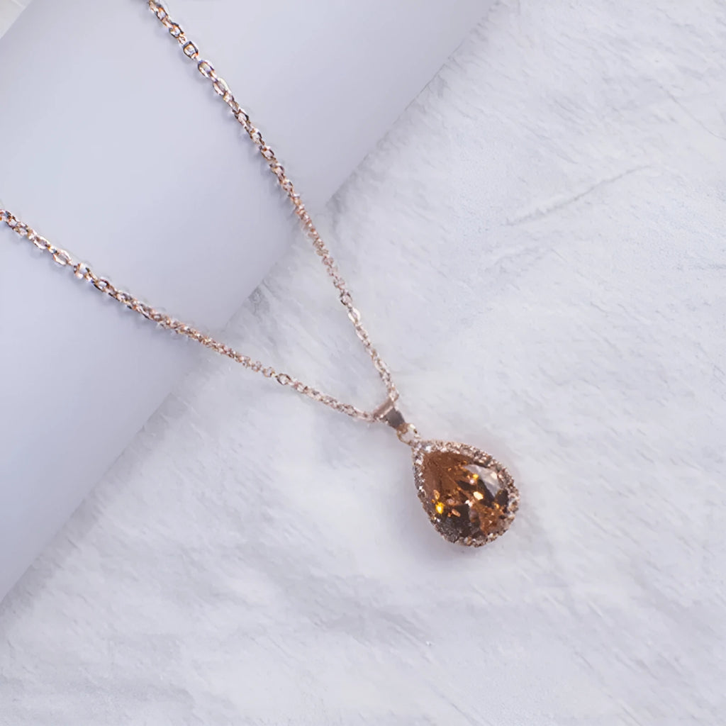 Water drop rose gold rhinestone geometric necklace pendant in pink colour with alloy construction