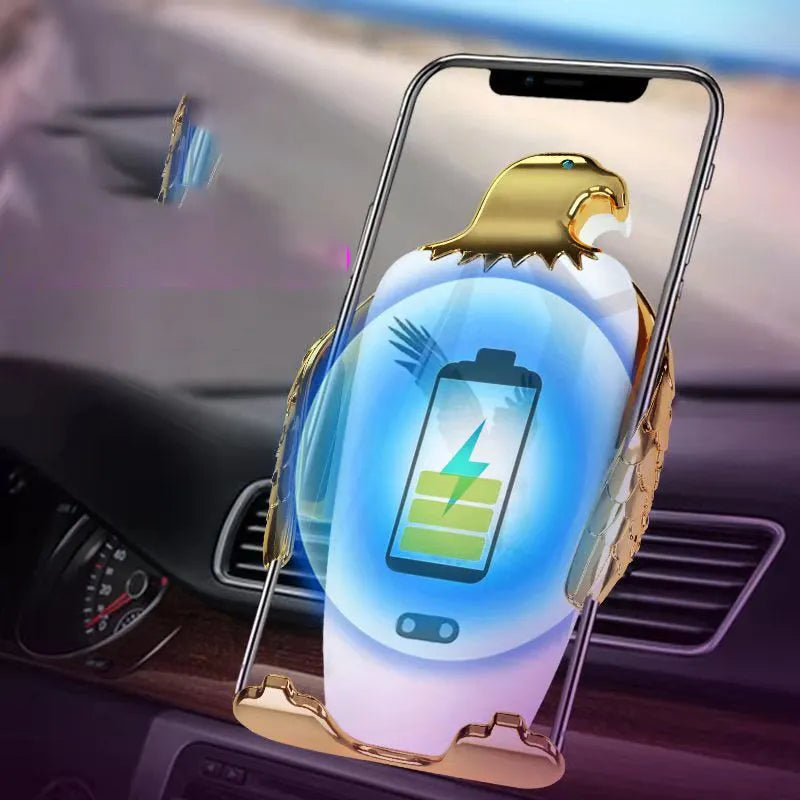 Car phone holder with wireless charging pad and Eagle design on a car dashboard.