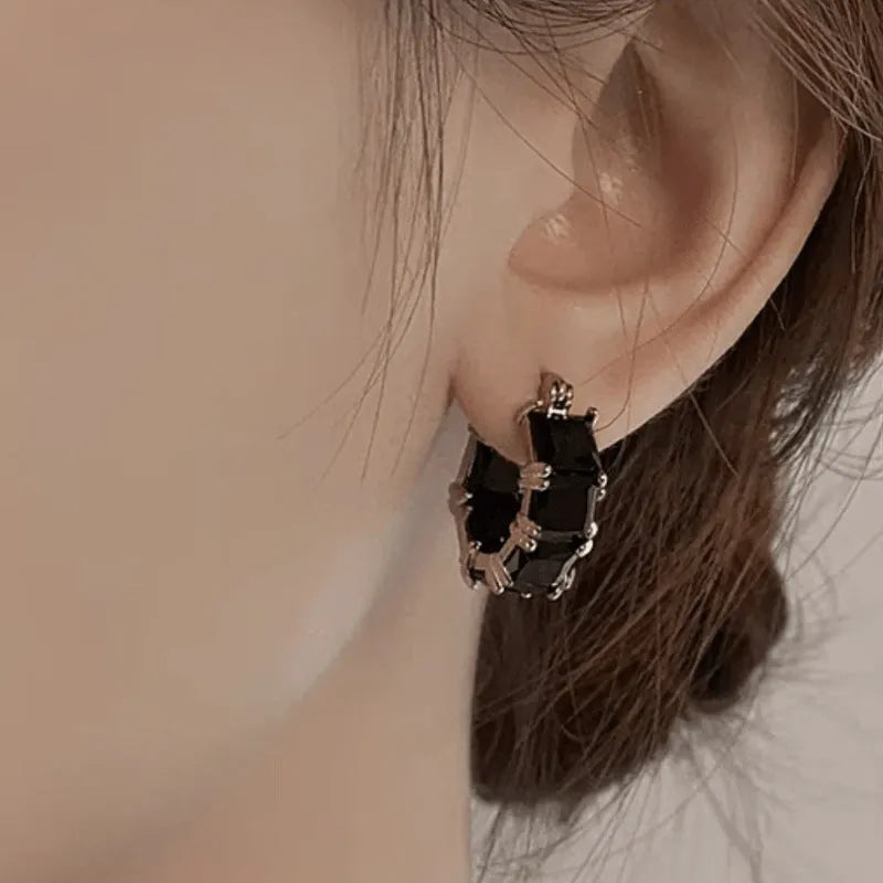 Geometric U-shaped gold-plated earrings with crystal zirconium decoration in black, pink or white options
