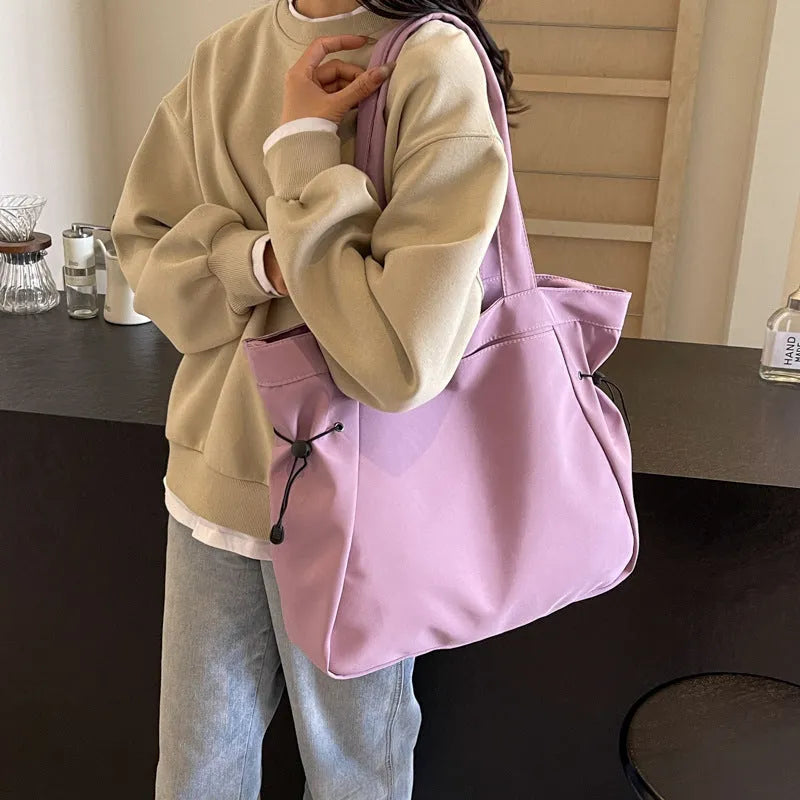 Soft foldable Oxford cloth commuter shoulder tote bag in street trend style.