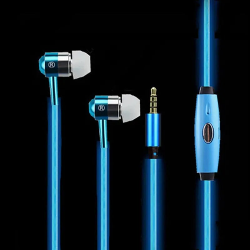 Close-up of blue LED earphones with aluminium alloy shells lit up, showing 3.5mm plug and inline remote.