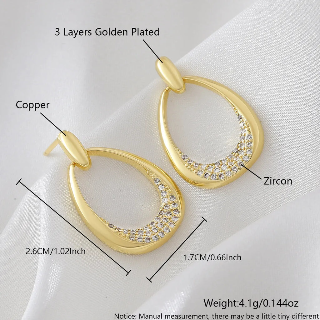 Women's copper geometric drop earrings with zircon details and electroplated yellow gold finish