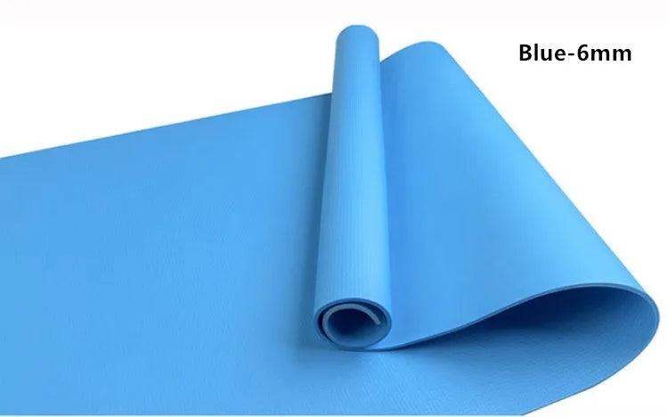 Red EVA fitness yoga mat showing texture and thickness, rolled partially with carry bag.