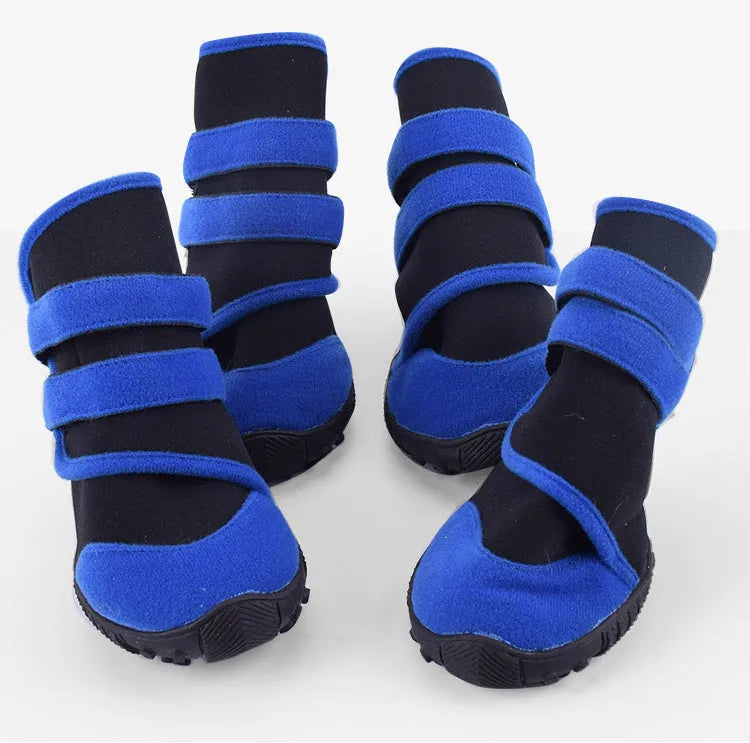 Waterproof pet shoes with wet suit fabric body, beef sole and multi-toothed non-slip tread in red or blue